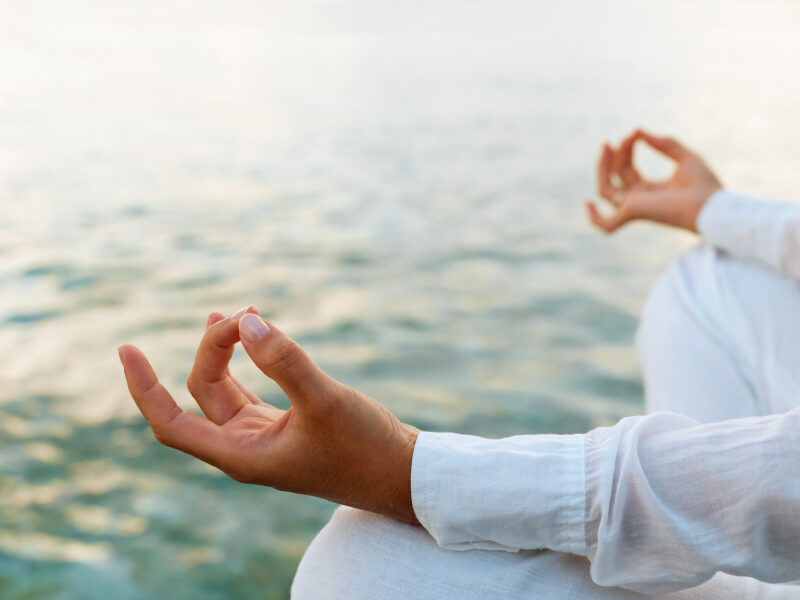 woman-practicing-yoga-at-sunrise